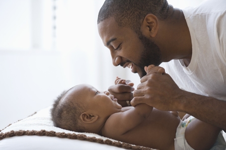 father and son laughing